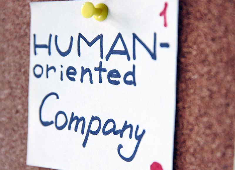 A note depicting the organizational value of being a human-oriented company. 